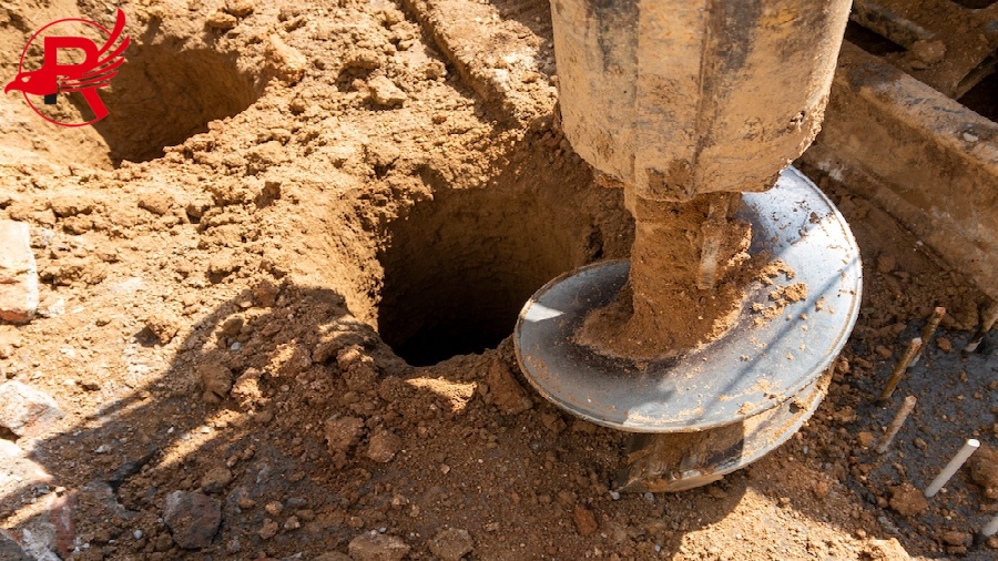 Hydraulic bore pile rig machine at the construction site.Drilling in the ground.Pile foundations.
